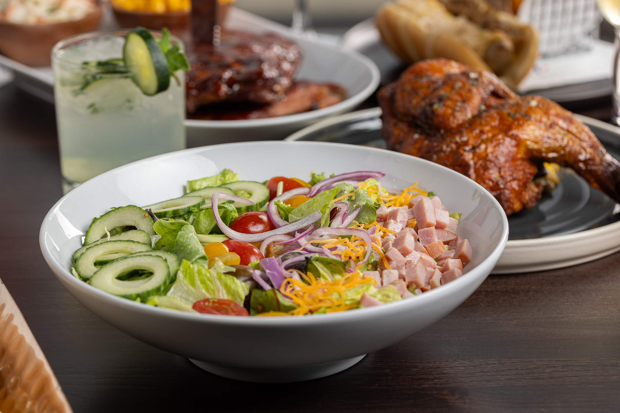 Chef salad with ham, cheddar, cucumber and tomatoes